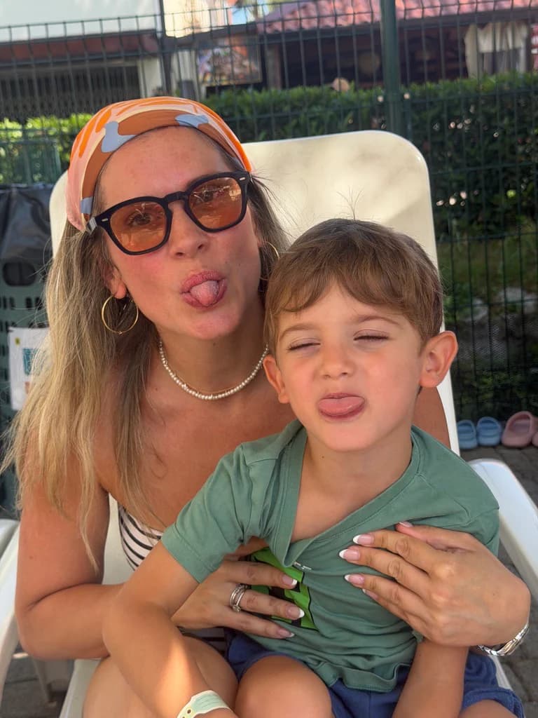 A mother and her young son pulling playful faces